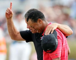Tiger Woods celebrates his emotional victory at the 2006 Open Championship with his caddy Steve Williams.
