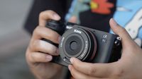 A photo of the Kase AF 24mm f/3.8 mounted on a Sony camera