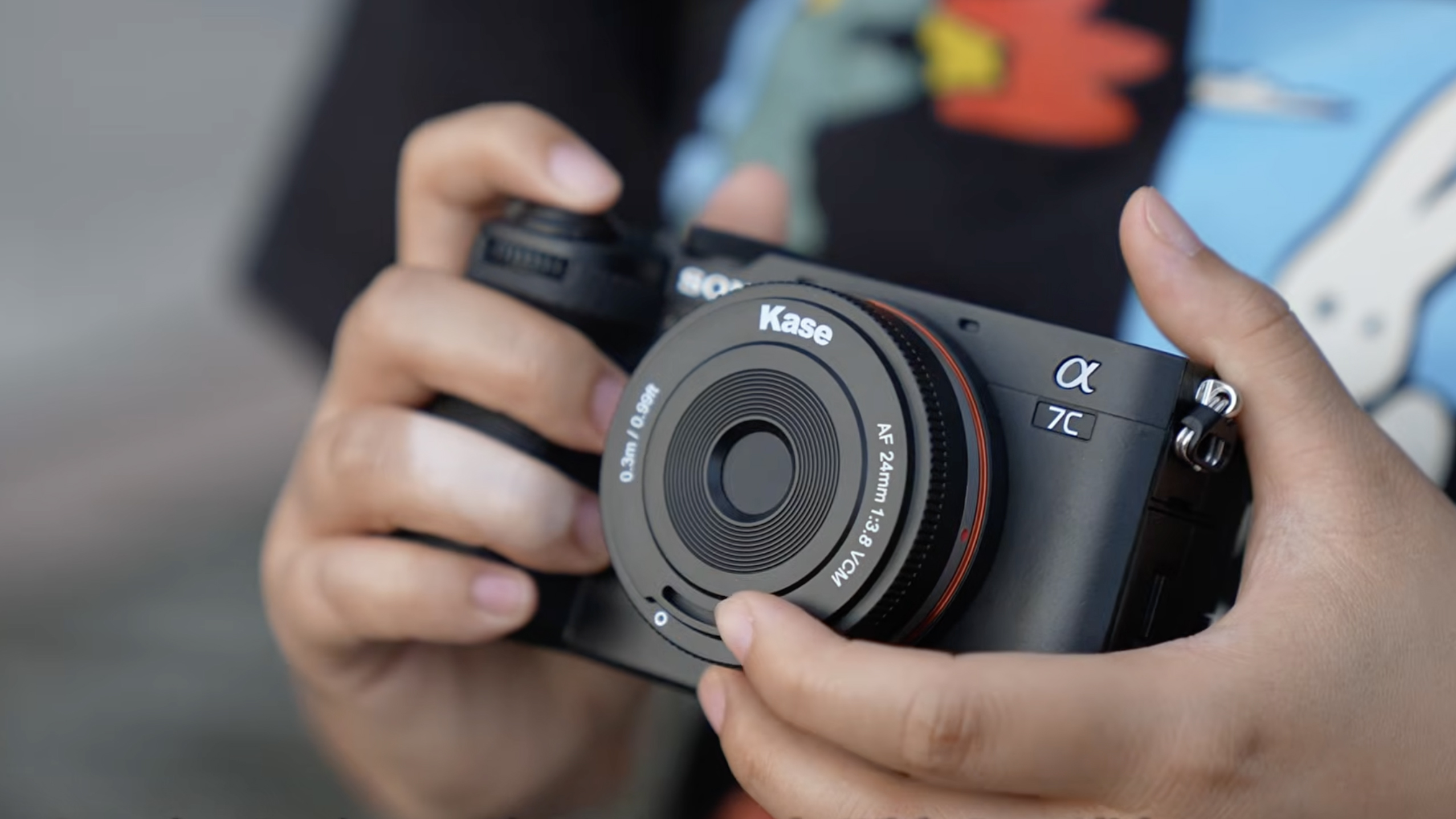 A photo of the Kase AF 24mm f/3.8 mounted on a Sony camera