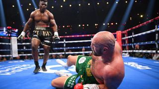 Francis Ngannou knocks down Tyson Fury in the Battle of the Baddest fight