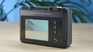 A black Leica Sofort 2 hybrid instant camera