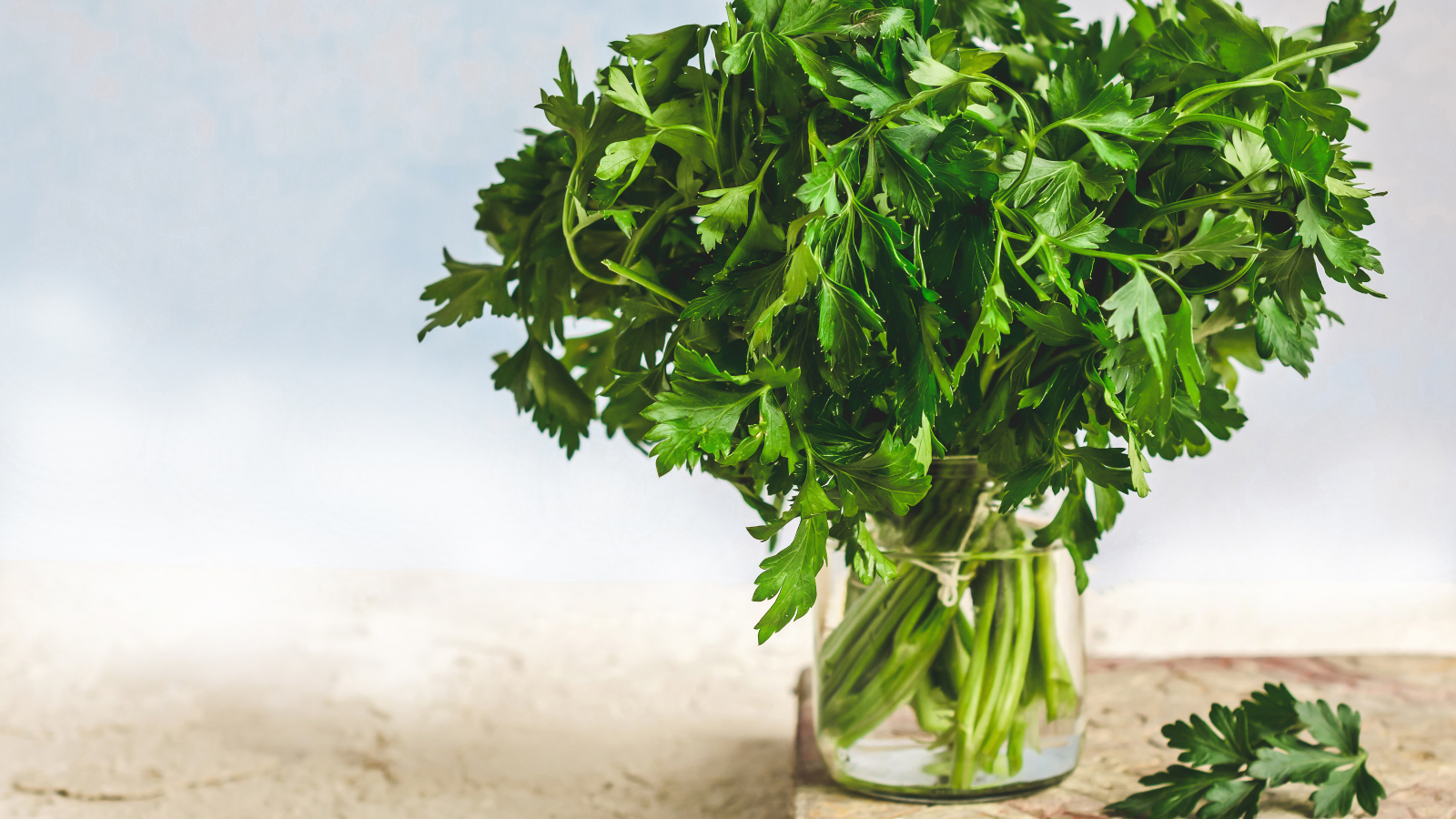Parsley stored in jar with water