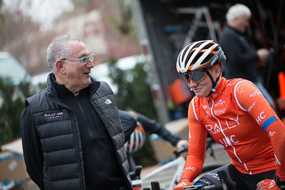 Rally UHC team owner Charles Aaron talks with Kelly Catlin at team camp in Oxnard, California