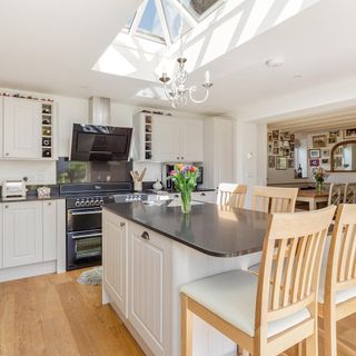 kitchen with white counter and chairs