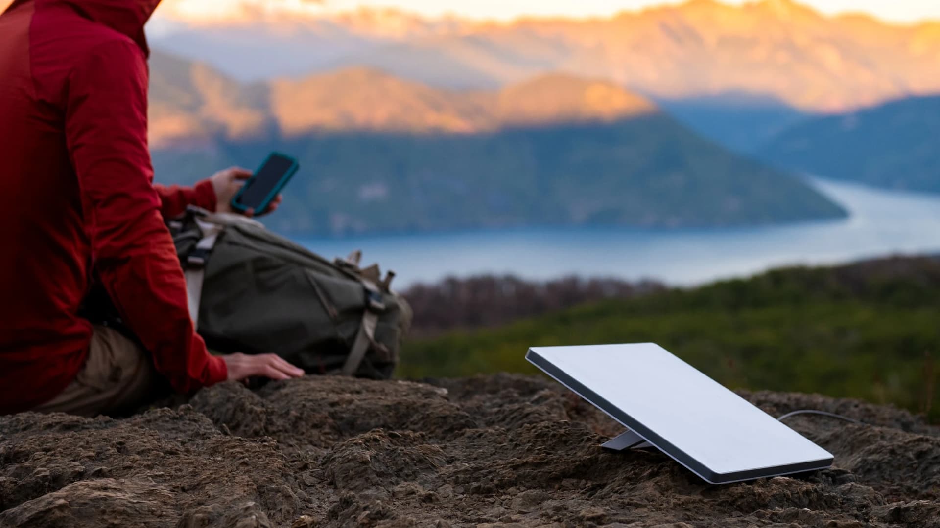A Starlink Mini satellite dish in use in the mountains.