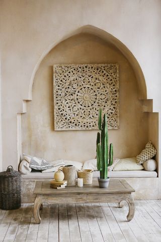 A living room nook with a potted cactus