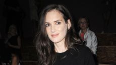 Winona Ryder wearing dinosaur graphic knit jumper at Coach Spring runway show in 2017