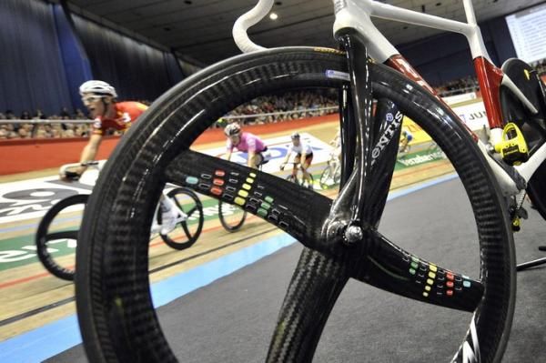 The riders fly past on the boards of the Kuipke Velodrome.