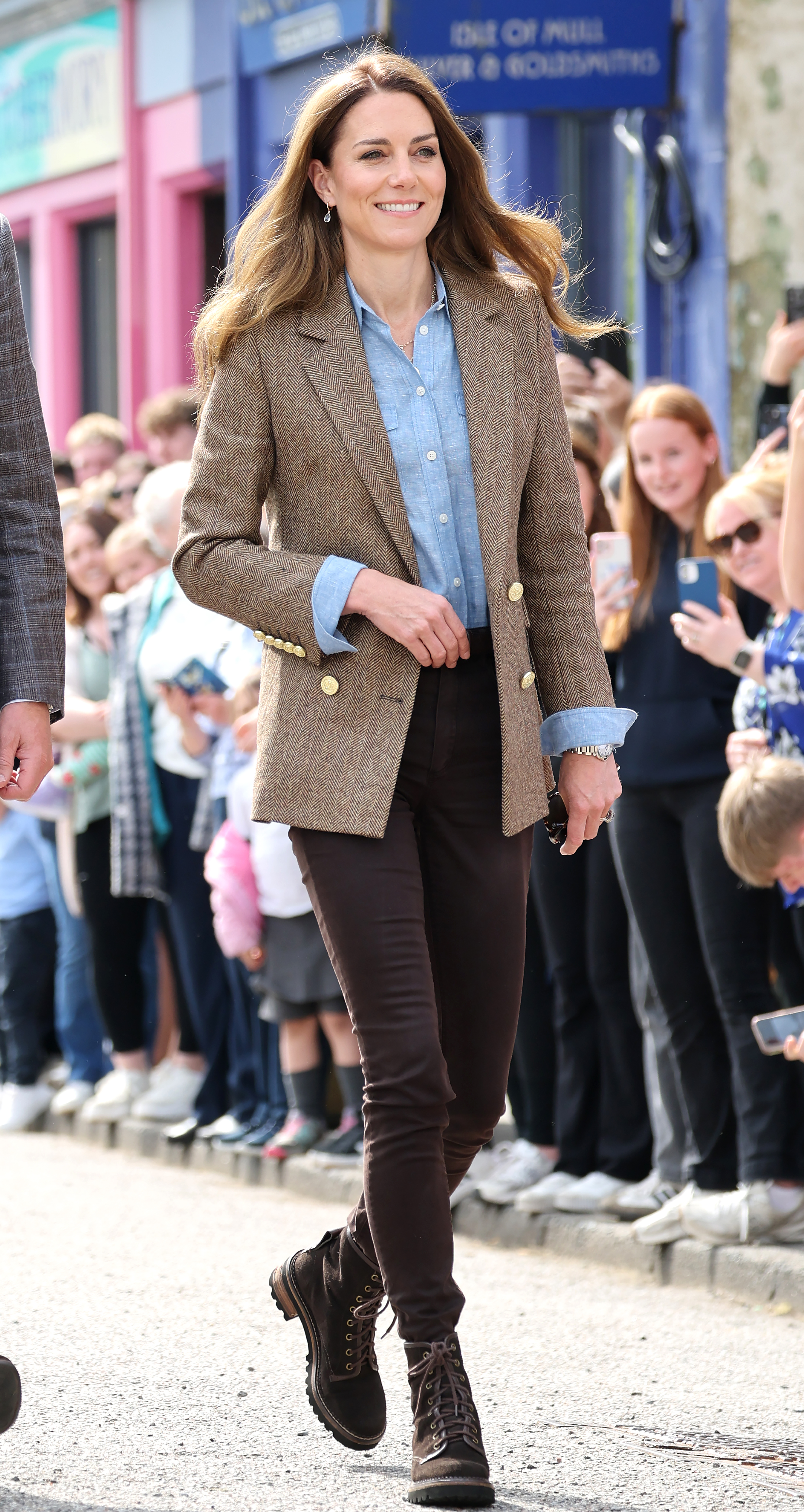 Kate Middleton wearing a blazer and jeans.
