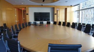 The audio system for this 36-seat boardroom is comprised of ClockAudio microphones recessed in the table, Biamp TesiraFORTE DSP, and Tannoy ceiling speakers. As this boardroom is at use for a large international bank, a Televic translation system is paired with Listen Tech IR radiators to ensure privacy and security.