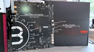 A photo of the Thermal Grizzly Der8enchtable test platform next to its retail packaging