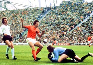 West Germany goalkeeper Sepp Maier collects the ball from the feet of the Netherlands' Johan Cruyff in the 1974 World Cup final.