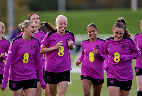 BURTON-UPON-TRENT, ENGLAND - OCTOBER 20: Alessia Russo, Grace Fisk and Ella Toone of England react during a training session at St Georges Park on October 20, 2025 in Burton-upon-Trent, England. 
