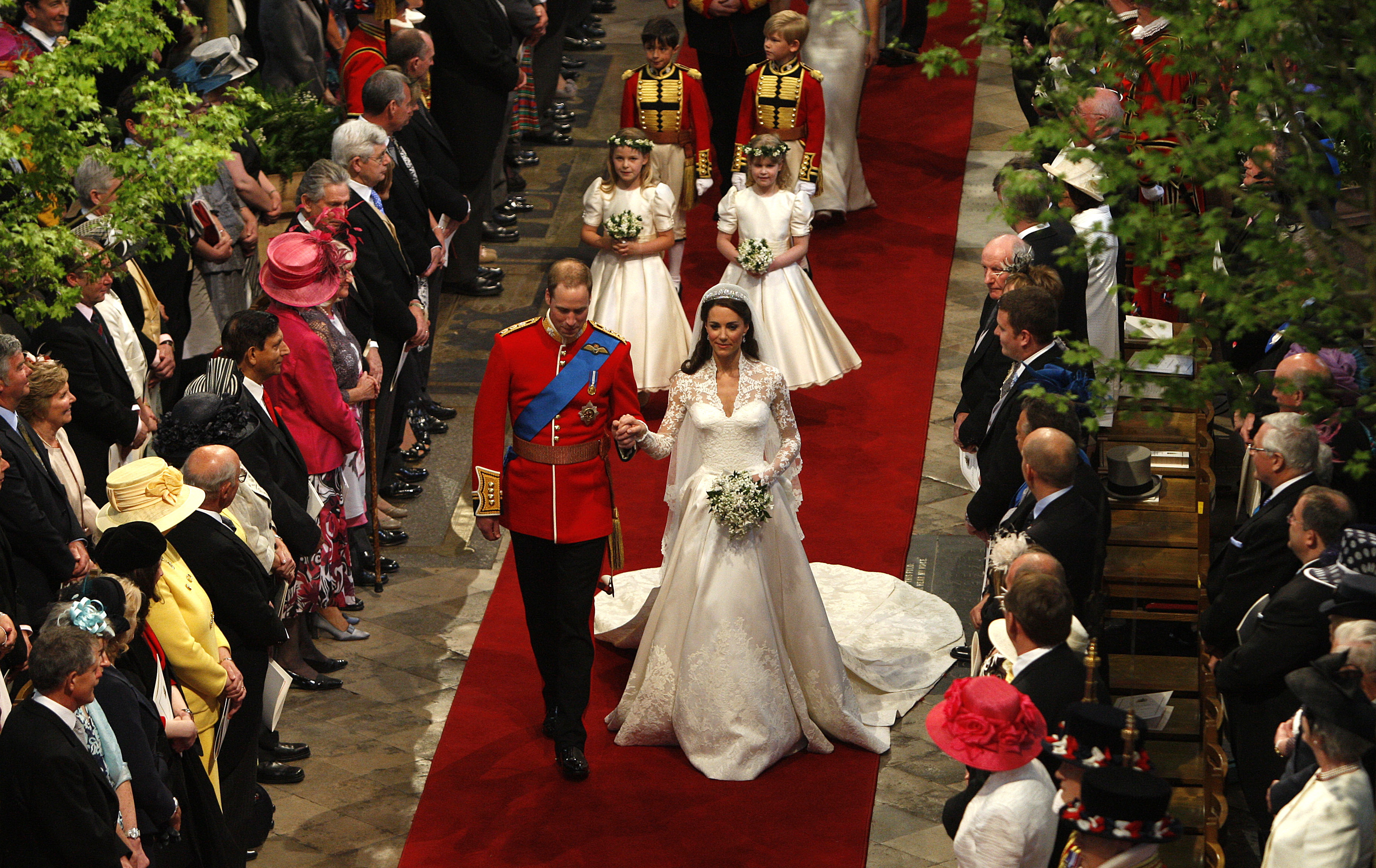 Kate Middleton and Prince William walking down the aisle at their wedding
