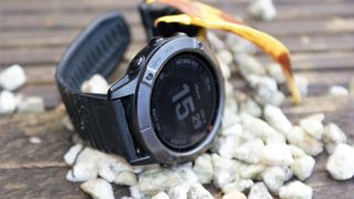 Image shows the Garmin Fenix 6X Pro Solar watch on table