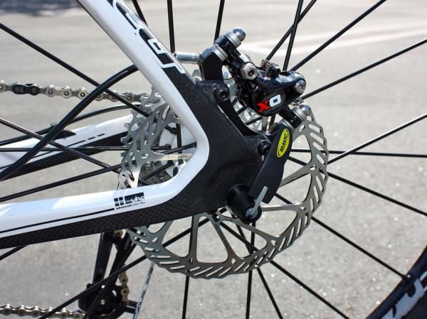 Carbon fiber Virtue frames skip the dropout pivot in favor of a full carbon rear end that flexes slightly as the suspension moves through its travel.