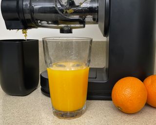 Fresh orange in a glass made using the Philips Viva Masticating Juicer appliance