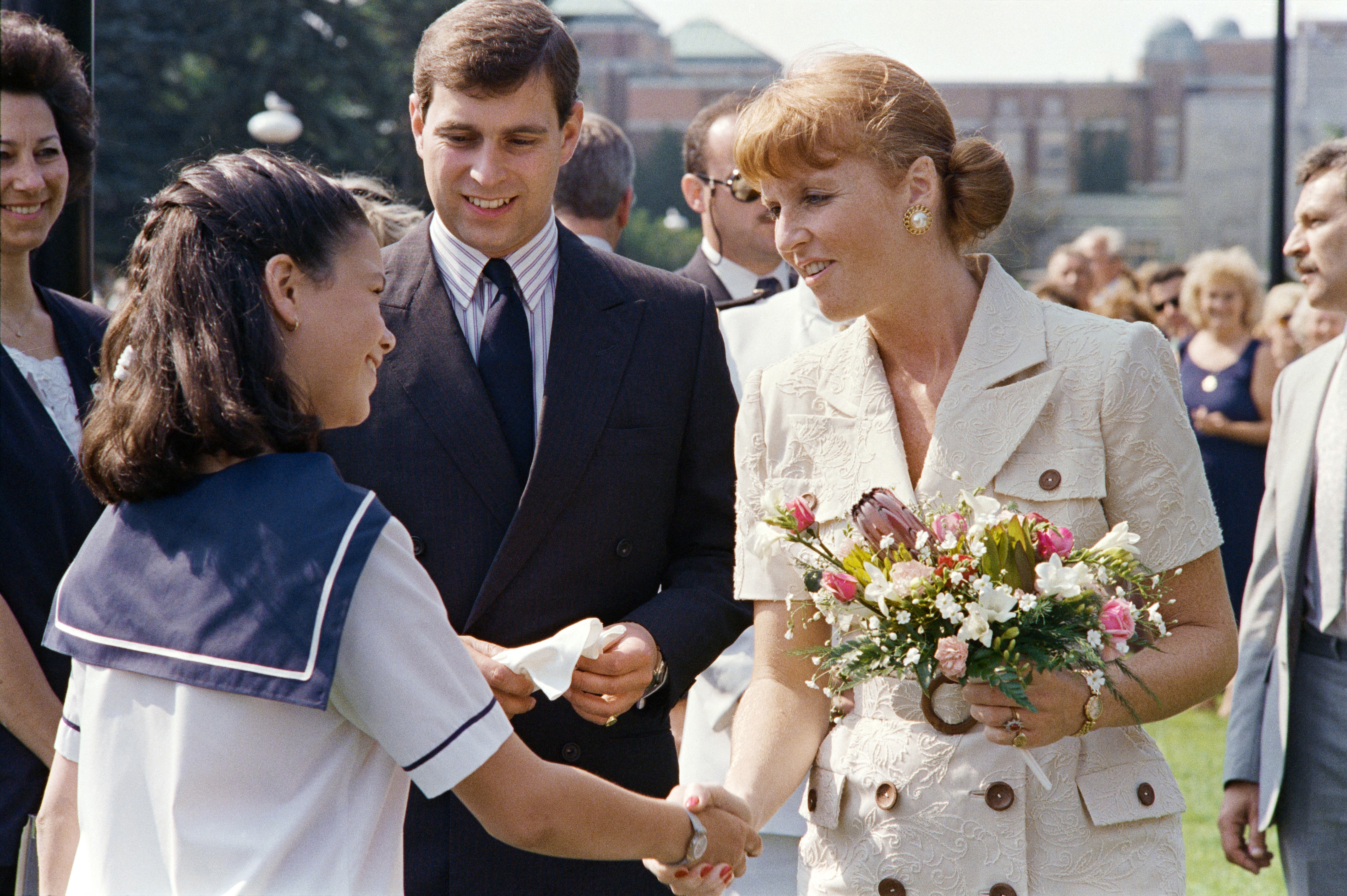 Sarah Ferguson and Prince Andrew shaking hands with a young girl in 1989 during their Canada tour