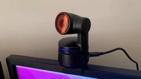 Obsbot Tiny 4K on a monitor with a blue LED light