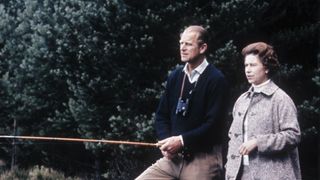 The Queen watches Prince Philip fishing on Balmoral