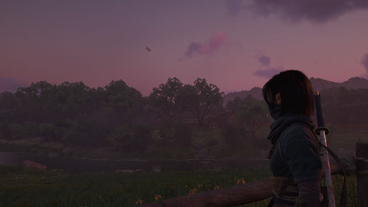 Assassin's Creed Shadow's screenshot of Naoe looking out over a purple hued sunset sky