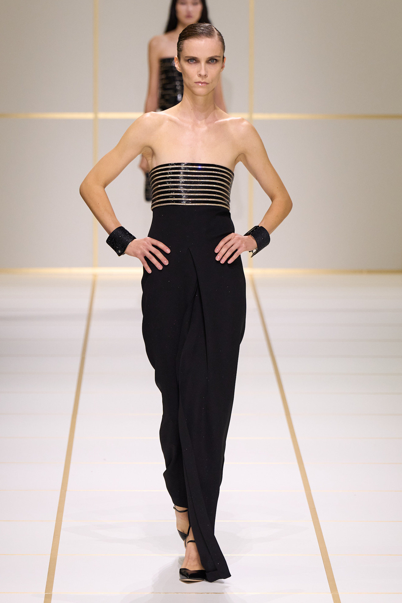 A model walks the giorgio armani s/s 27 runway.