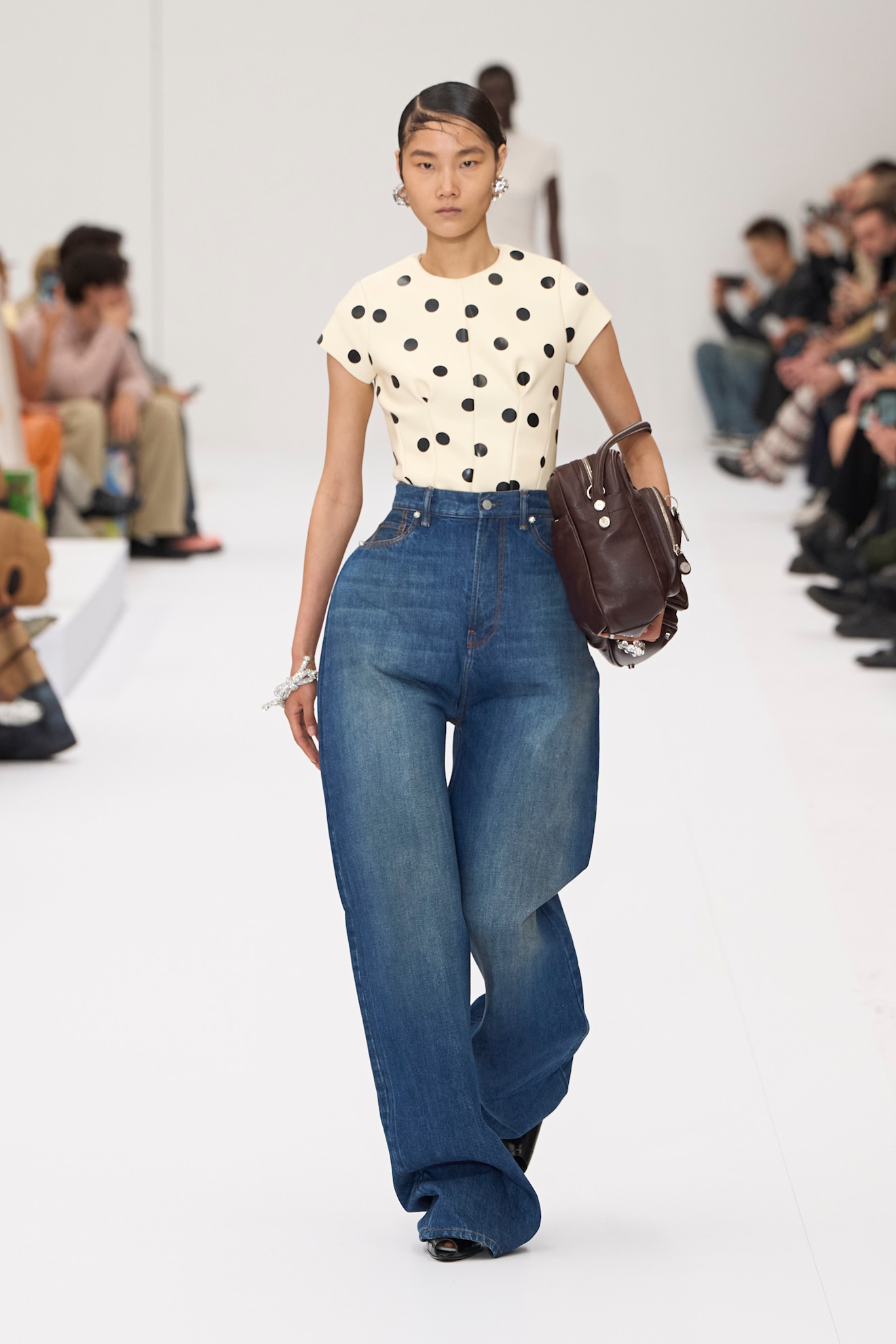 Model wears Horseshoe jeans on the Acne Spring/Summer 2025 runway.