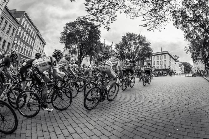 The Grand Prix Cycliste de Qu&eacute;bec peloton negotiates a sector of cobbles during the 12.6km circuit