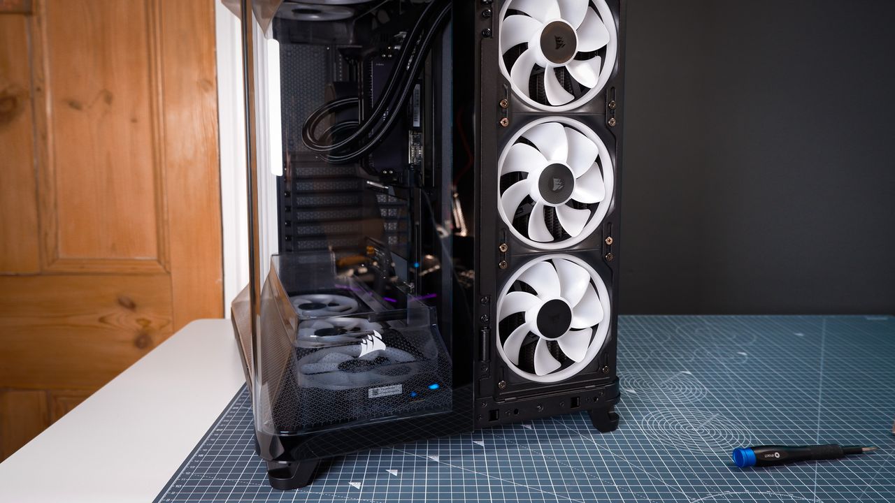 A Corsair Air 5400 PC case on a desk with various parts installed.