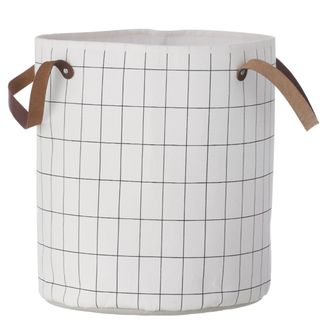 dirty laundry with grid basket and white background