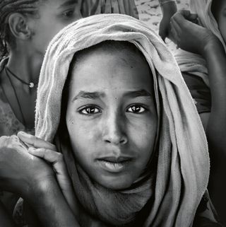 a portrait of an individual close up wearing a headscarf