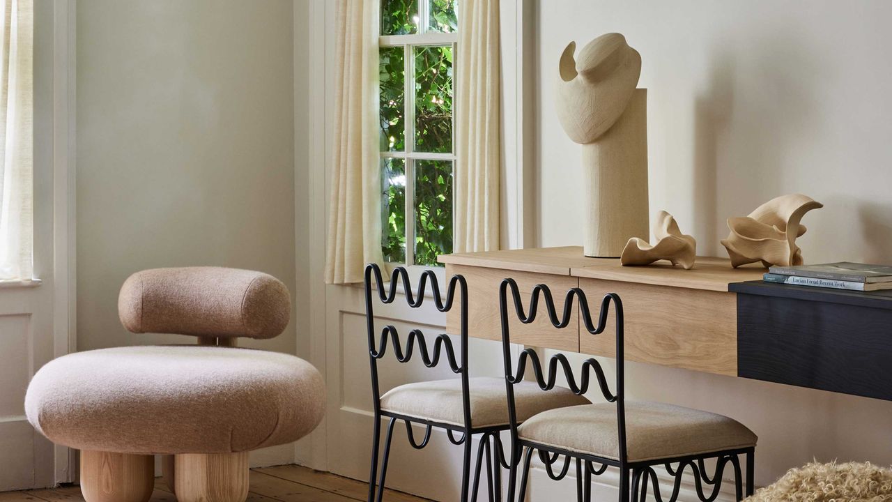 a living room with modern stylish chairs