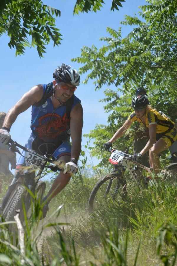 Although the women's field started a minute behind the men, Abby Strigel (Honey Stinger / Bontrager) was already working her way through the elite men through the first section of singletrack at CamRock.
