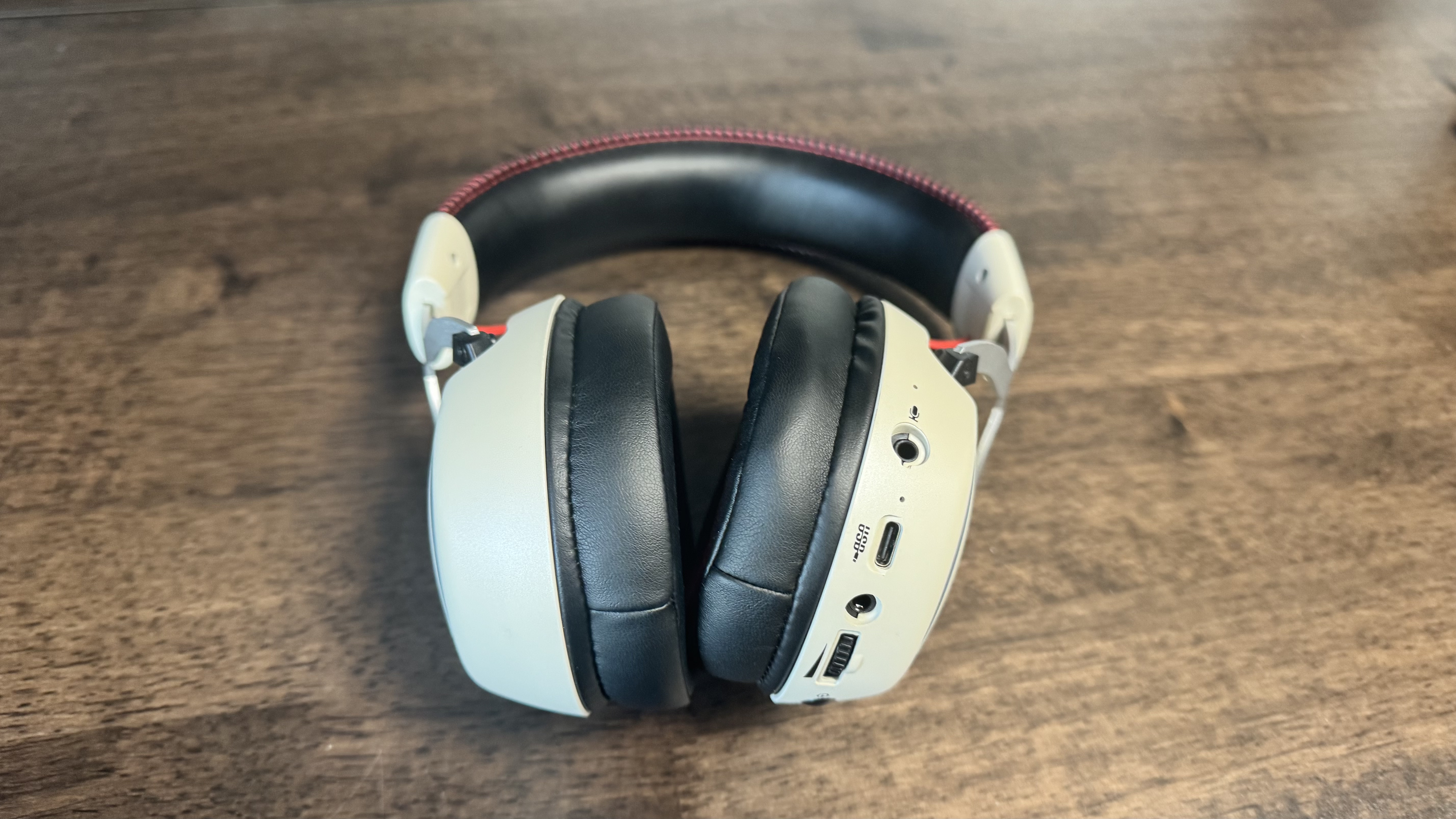 OXS Storm G2 budget gaming headset on a wooden table