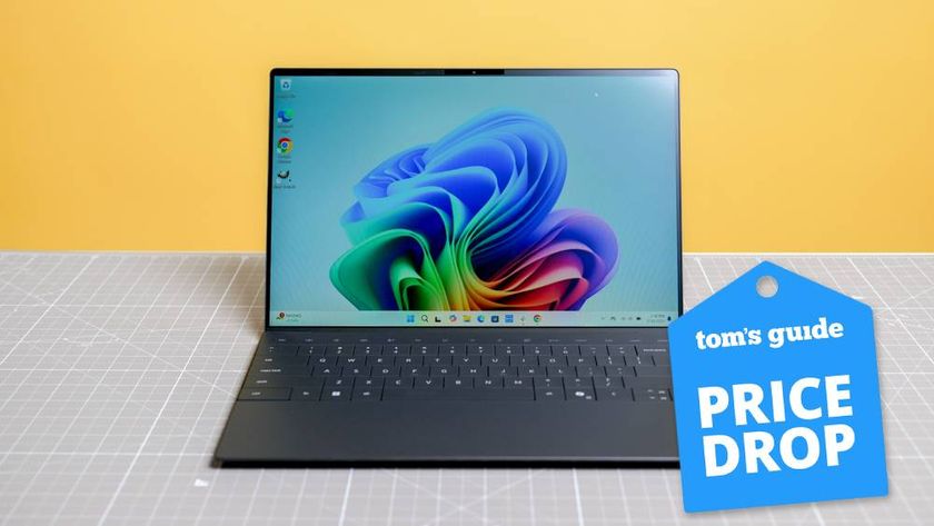 Dell XPS 13 on yellow background with Tom&#039;s Guide Price Drop badge