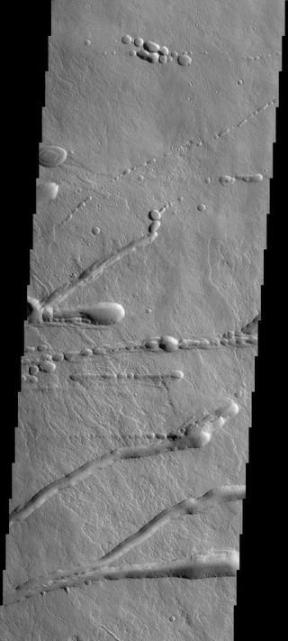 Volcanoes Cross the Martian Surface