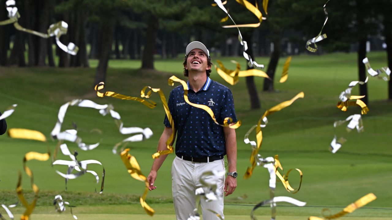 Nico Echavarria looks up while gold and silver streamers fall on him at the 2024 Zozo Championship