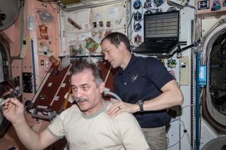 Expedition 35 Crewmembers Get Haircuts