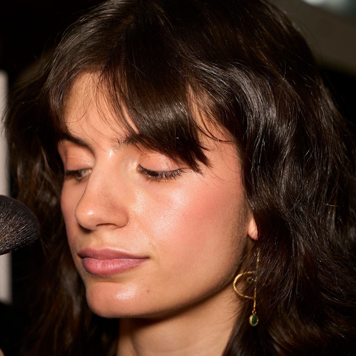 model backstage with tanned skin