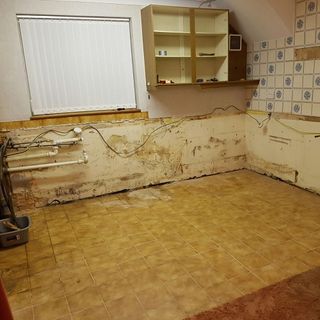 kitchen renovation with white wall and tiles floor
