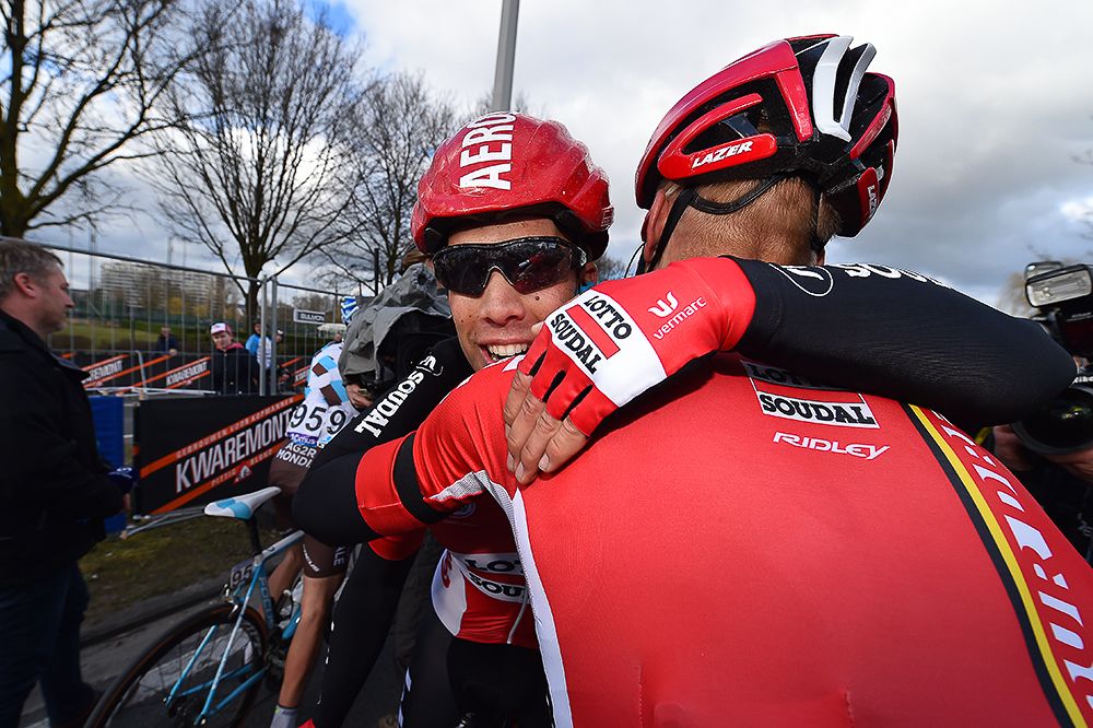 Jens Debusschere (Lotto Soudal) celebrates with a teammate after winning Dwars door Vlaanderen