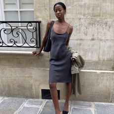 90s capsule wardrobe: @sylviemus_ wears a grey slip dress with mules