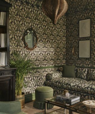 patterned sofa and patterned wallpaper; pattern drenching in the living room