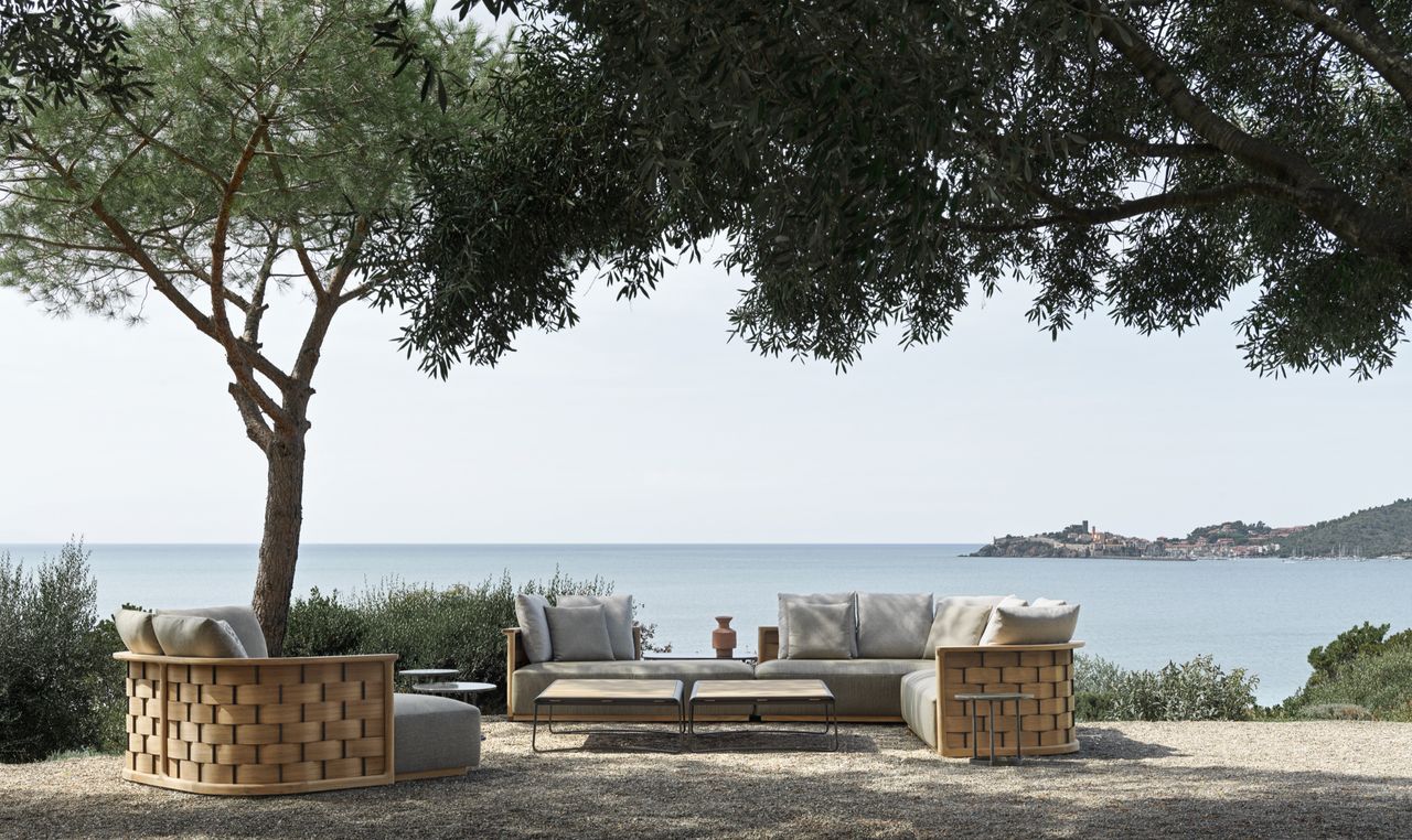 Molteni&amp;C outdoor furniture beside trees and sea