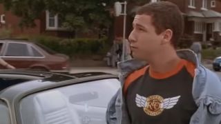 Adam Sandler wearing a jean jacket and a REO Speedwagon tee shirt in Billy Madison