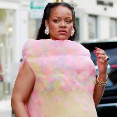 Rihanna was spotted in L.A. wearing Puma x Ottolinger sneakers and a pastel yellow and pink dress