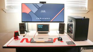 A picture of a computer desk with a desk mat