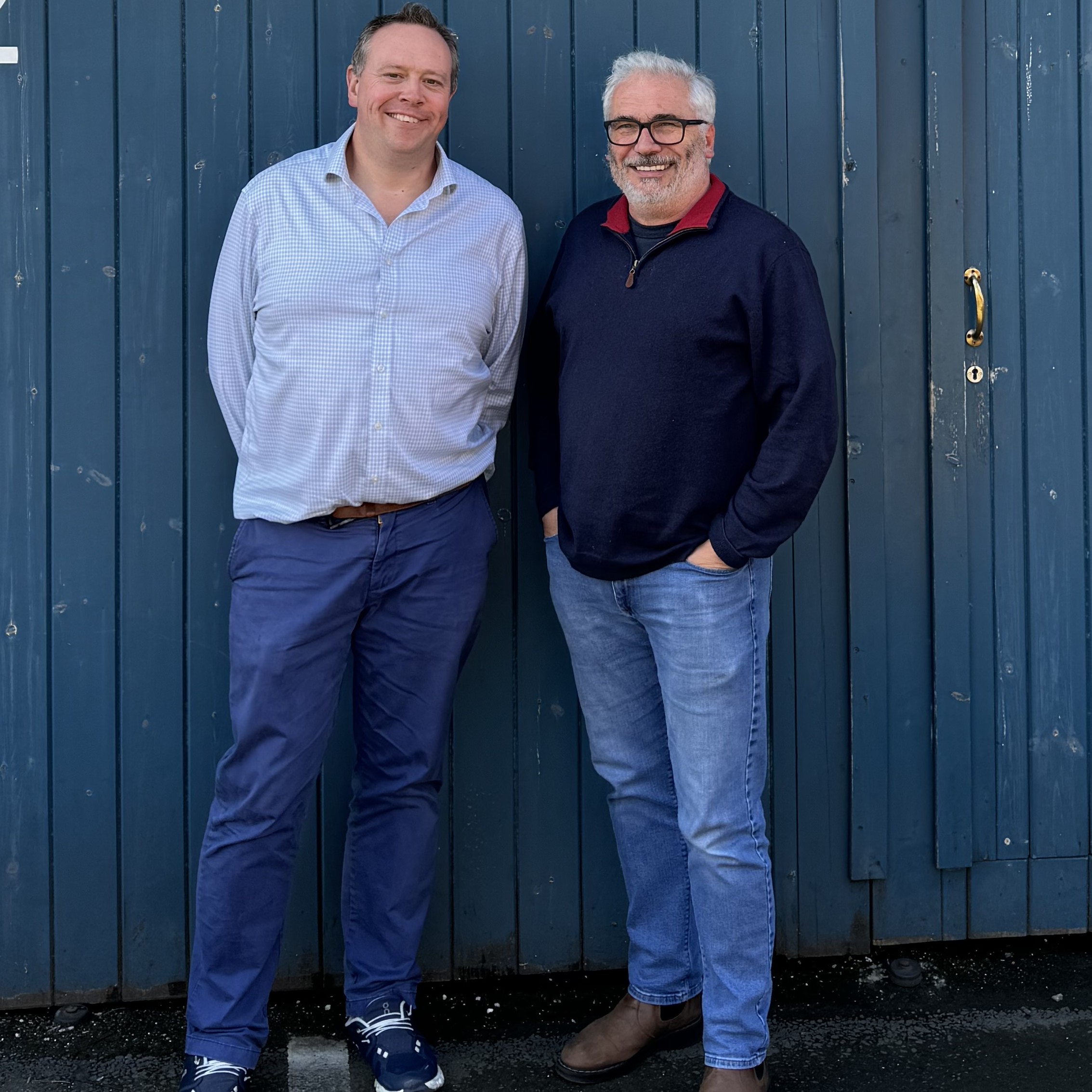 Pufferfish CEO Steven Patterson (left) is all smiles with Pufferfish employee.