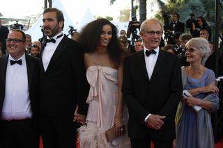 From left : British actor Justin Moorhouse, French actor and former football player Eric Cantona and his wife Rachida Brakni, British director Ken Loach and his wife, arrive for the screening of their movie "Looking for Eric" in competition at the 62nd Cannes Film Festival on May 18, 2009. AFP PHOTO / VALERY HACHE (Photo credit should read VALERY HACHE/AFP via Getty Images)