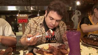 Adam Richman chowing down on the Big Texan Challenge in Man v. Food